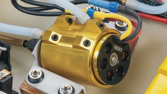 The powerful 6-pole, 36-56-1800, water-cooled brushless motor is positioned near the back of the boat, with a coupler assembly that uses hardened steel to lock the cable securely in place. 